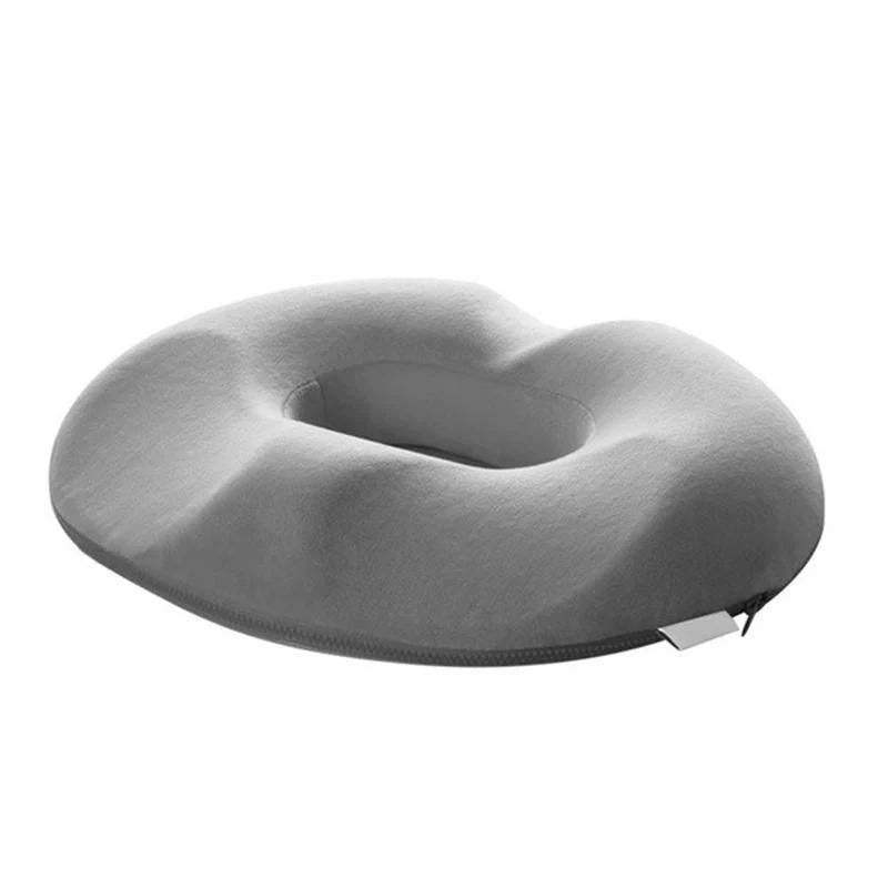 Men's orthopaedic seat cushion on office chair demonstrating stable positioning with non-slip base