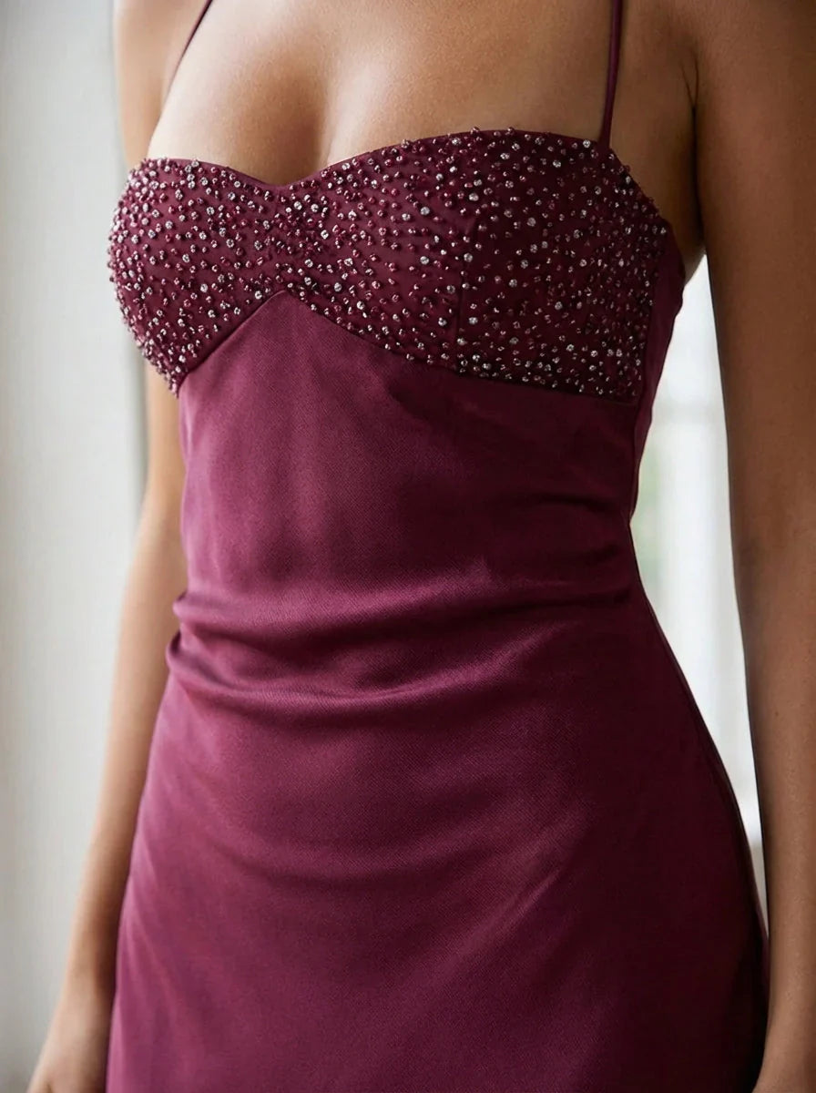 Evening maxi dress with halter neck straps and beaded empire waist bodice