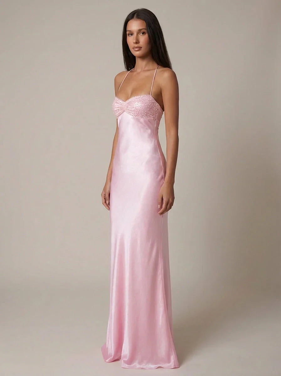 Front view of pink halter maxi dress showing empire waistline and beaded neckline detail