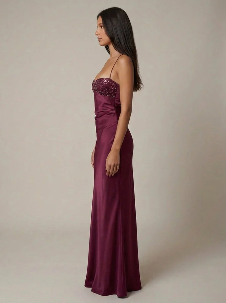 Formal halter neck maxi dress with beaded bodice and sleek satin-like material