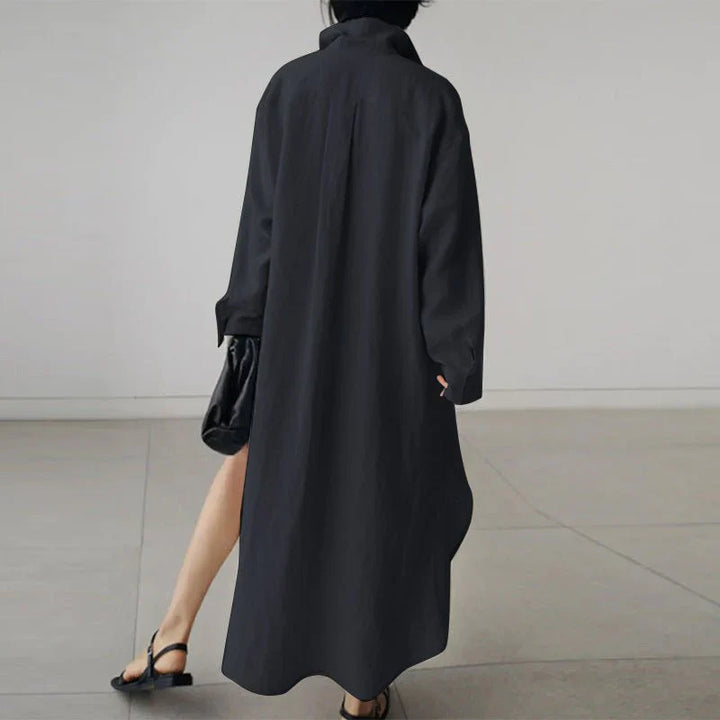 Full-length view of black cotton shirt dress with classic collar and midi length