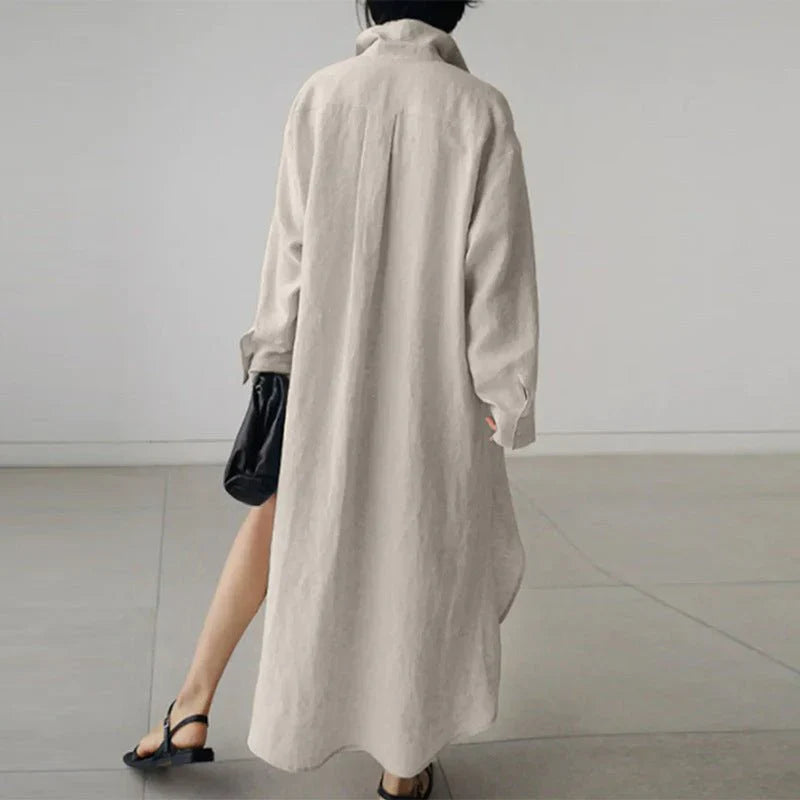 Back view of oversized cotton shirt dress showing relaxed drape and length