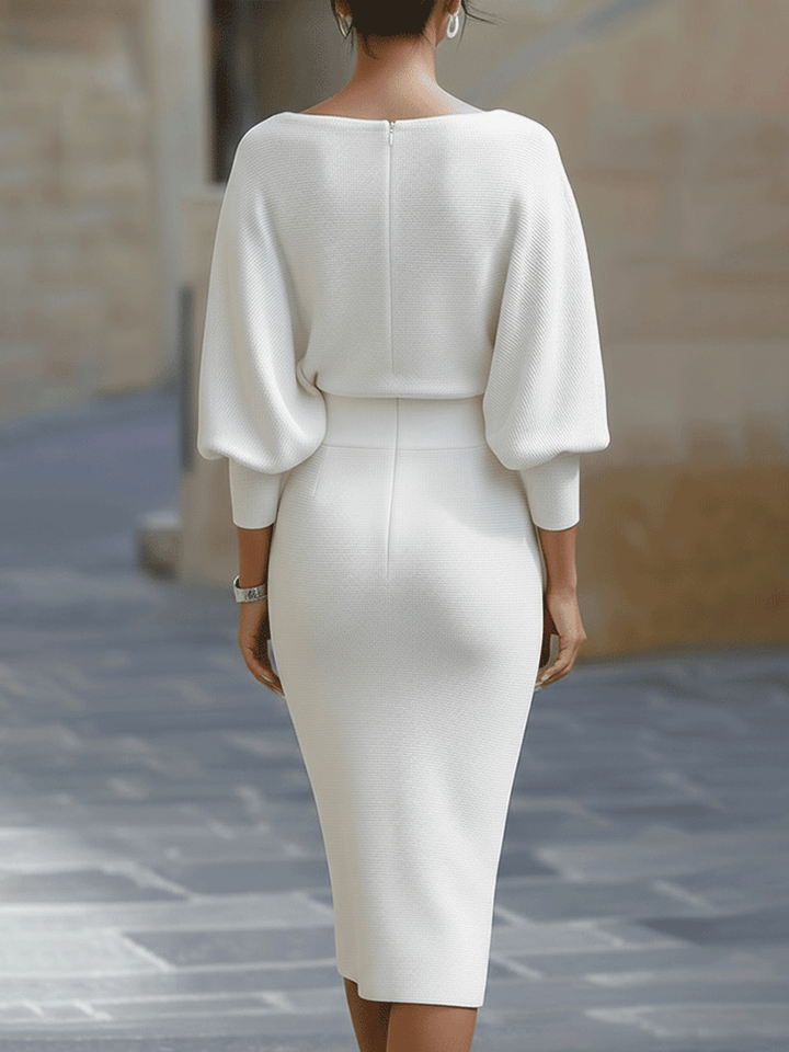 Woman wearing the ribbed knit midi dress with sunglasses for a polished daytime look