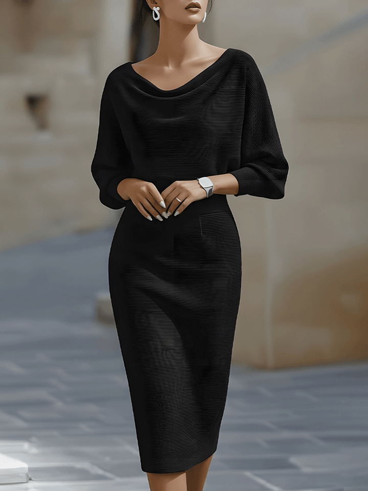 Back view showing the boat neckline and batwing sleeve construction of the midi dress
