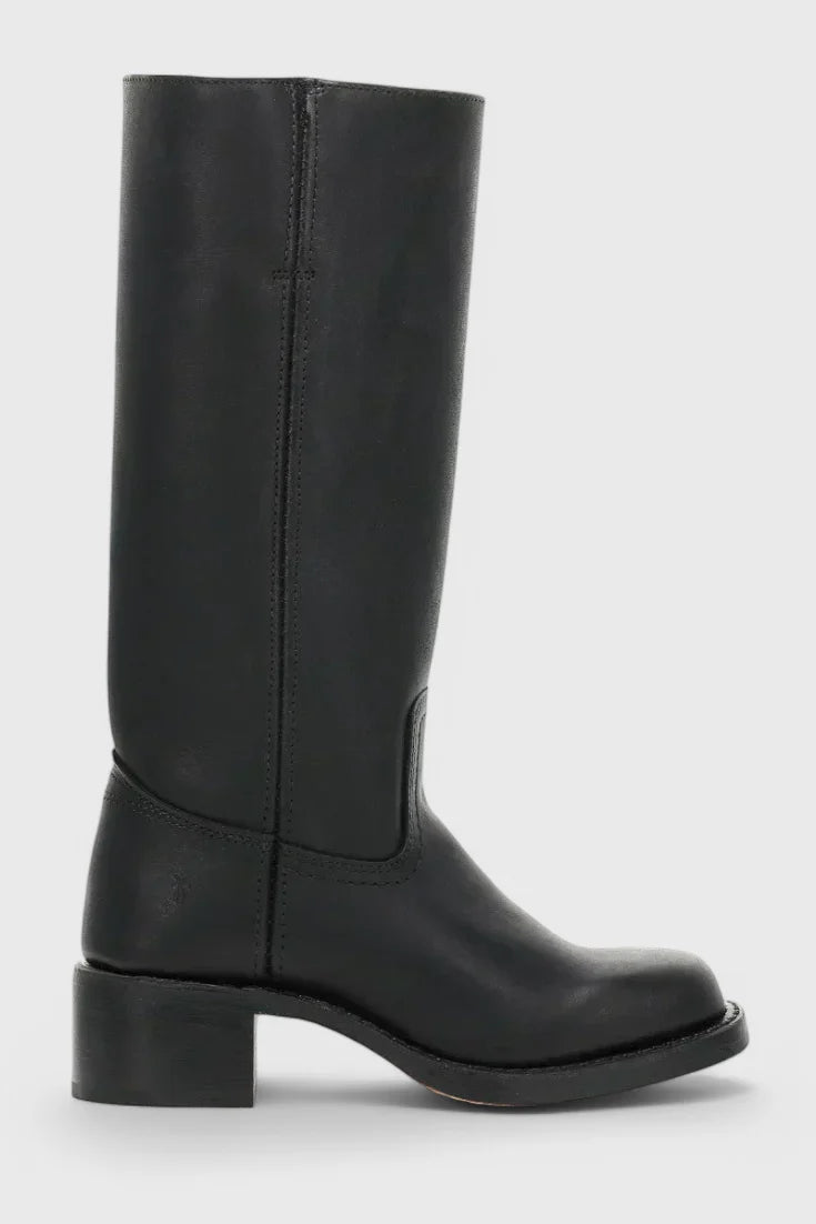 Side angle of women's knee-high heeled boots showing block heel elevation