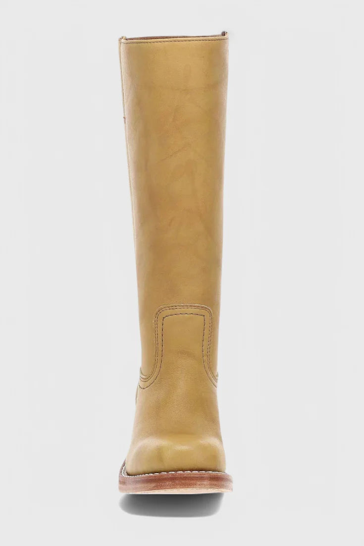 Close-up of knee-high heeled boots pull-on construction and calf fit
