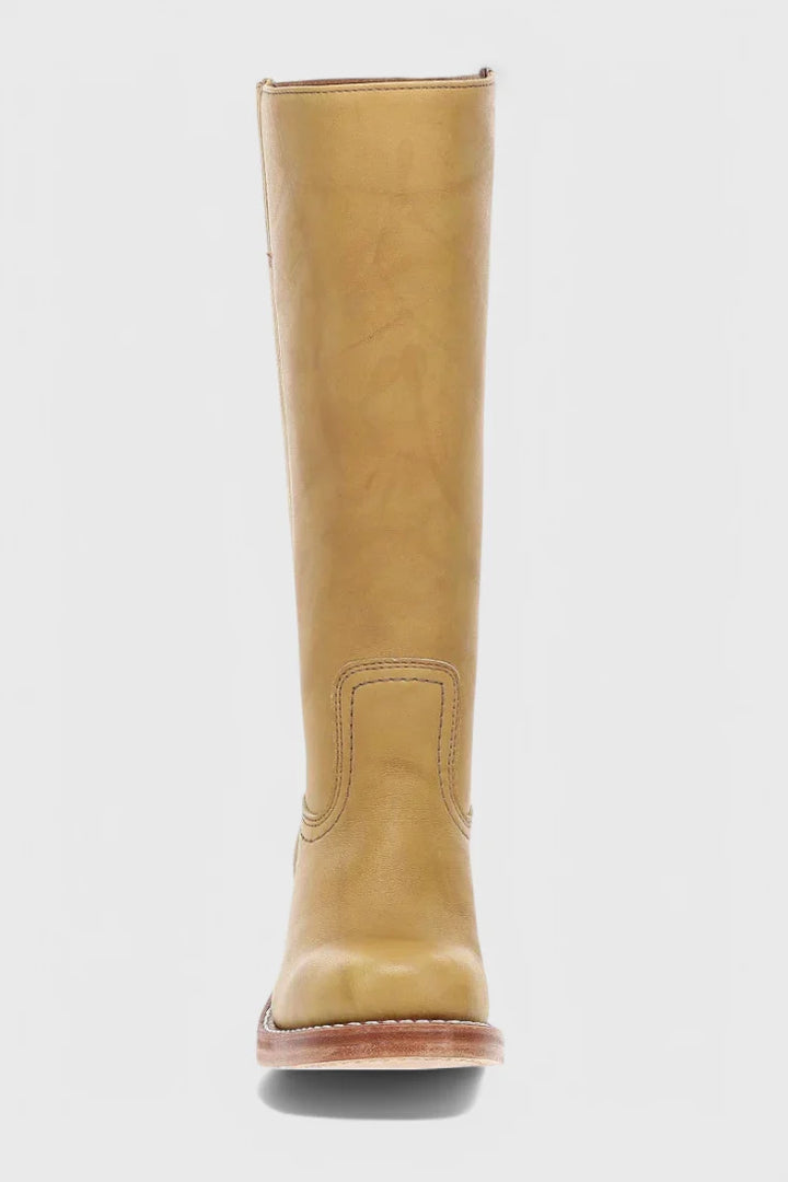 Close-up of knee-high heeled boots pull-on construction and calf fit