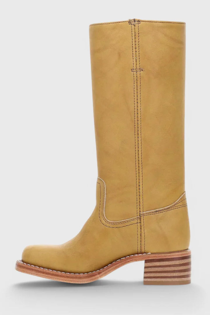 Women's Classic Knee-High Heeled Boots styled with tailored trousers