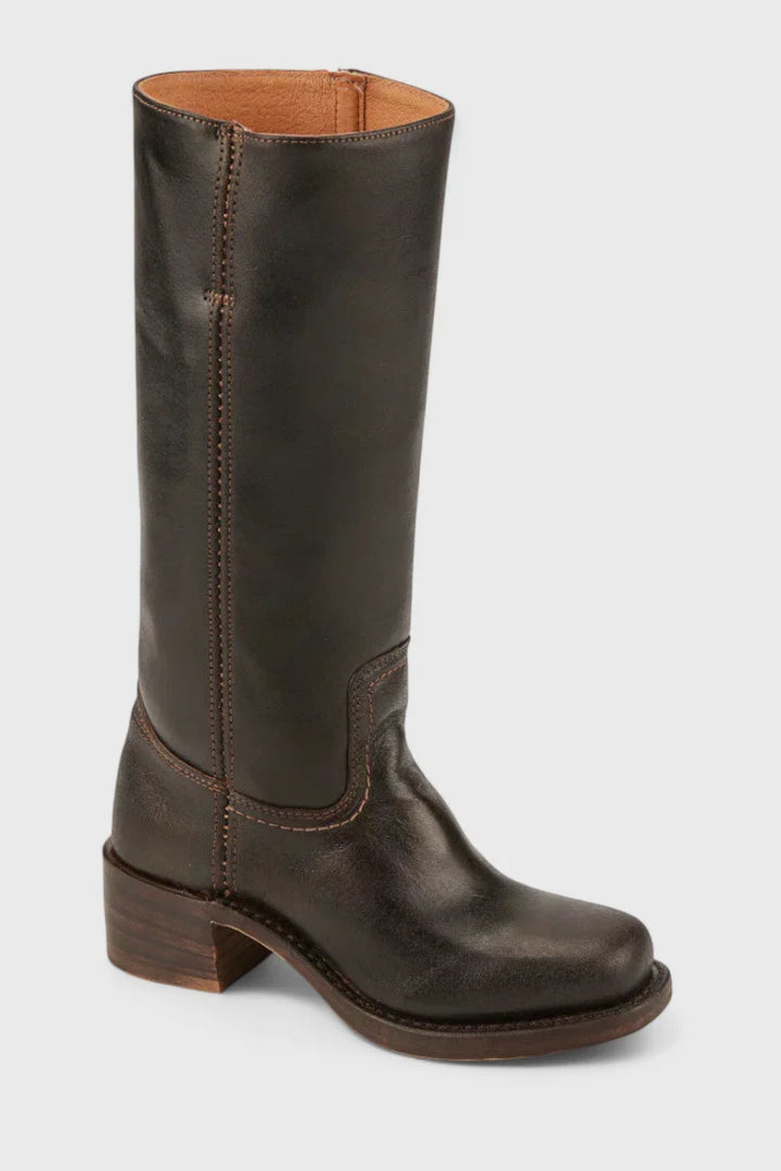 Detail shot of block heel and sole construction on knee-high boots