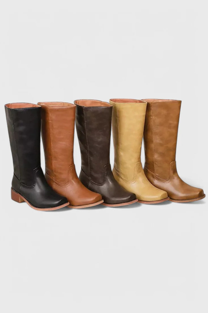 Close-up of Classic Knee-High Heeled Boots topstitching and smooth finish detail