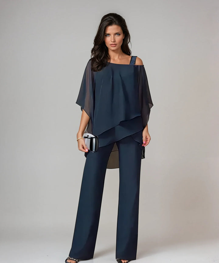 Back view of cold shoulder two-piece set with asymmetric layered top design