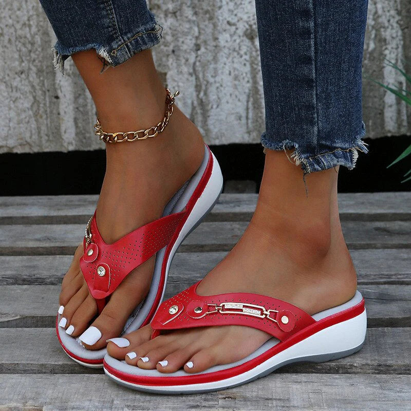 Women's orthopedic flip-flop sandals featuring cushioned insole and decorative hardware accent on upper