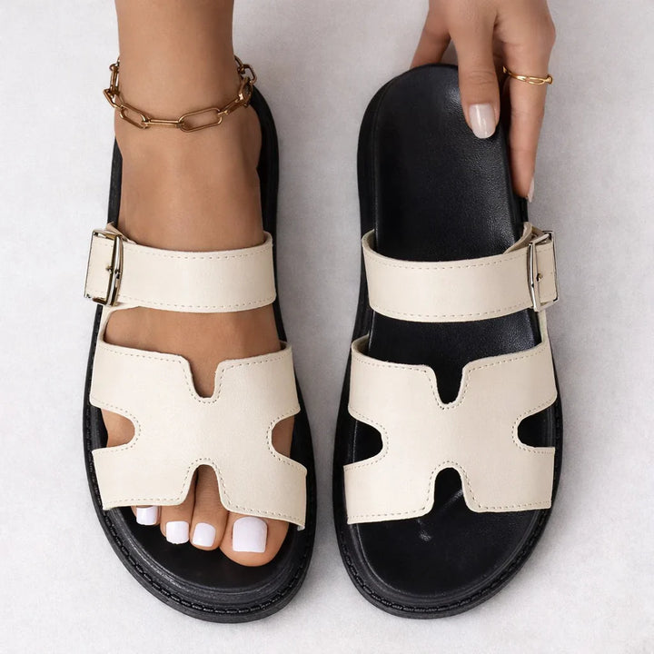 Black platform sandals with chunky sole and matte finish, ideal for everyday wear