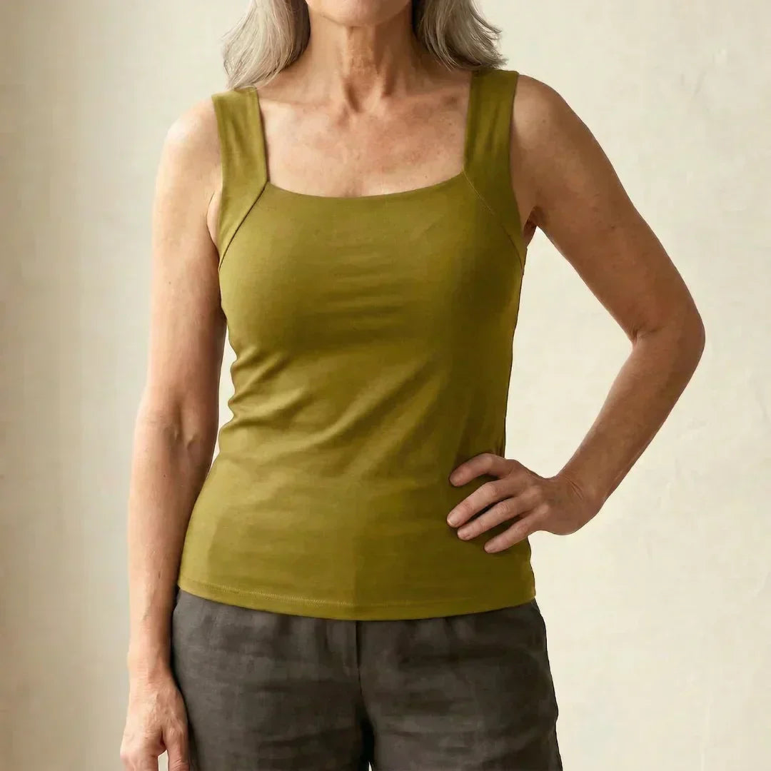 Close-up view of tank top hem showing hip-length cut and clean finishing details