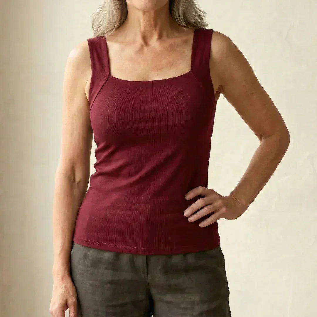 Woman styling taupe square neck tank with relaxed trousers for effortless summer dressing
