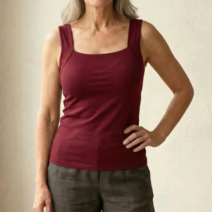 Woman styling taupe square neck tank with relaxed trousers for effortless summer dressing
