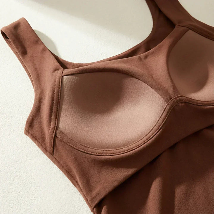 Detail shot of wide tank top straps and smooth knit fabric texture in taupe shade