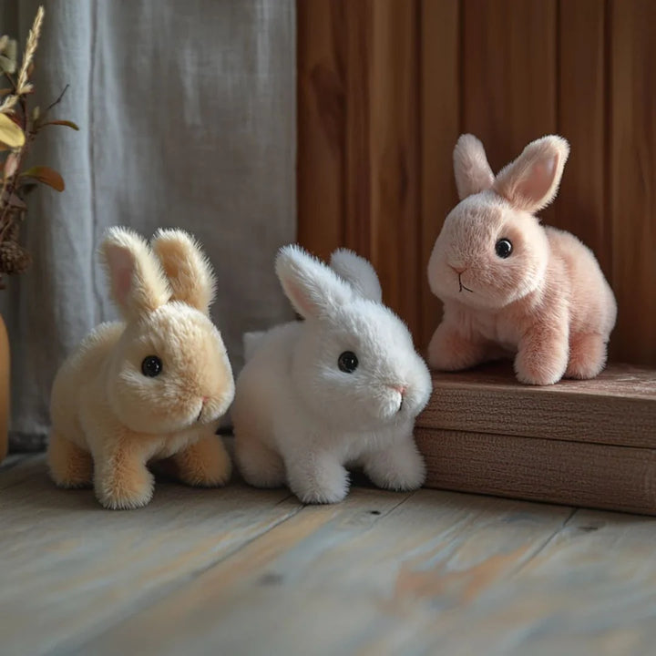 Interactive plush bunny toy in pink demonstrating compact size and cuddly design for all ages