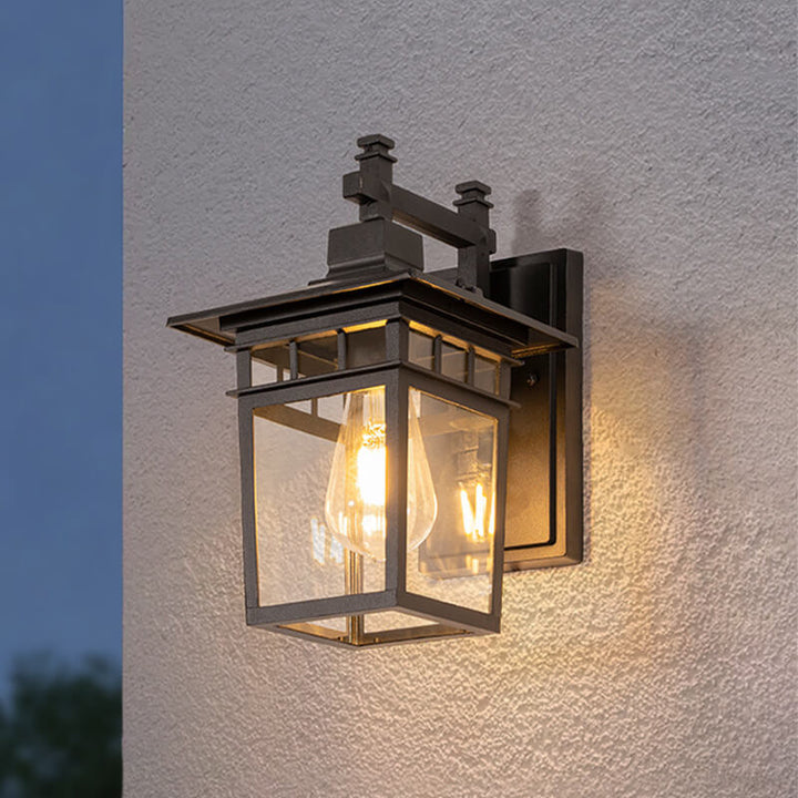 Close-up view of outdoor waterproof lantern wall light showing structured aluminium frame and transparent glass housing