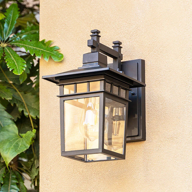 Copper finish outdoor waterproof lantern wall light casting ambient glow on exterior wall surface