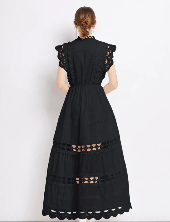 Side angle of lace maxi dress showing tiered skirt layers and scalloped trim detail