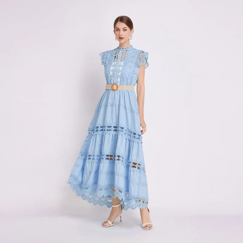 Detail shot of scalloped lace edging and tiered construction on maxi dress hem