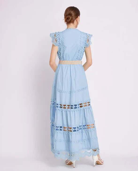 Back view of lace maxi dress with high neckline and tiered skirt design