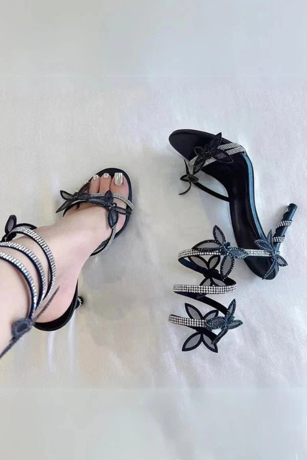 Butterfly ankle strap heels worn with dress showing leg-lengthening heel and secure fit