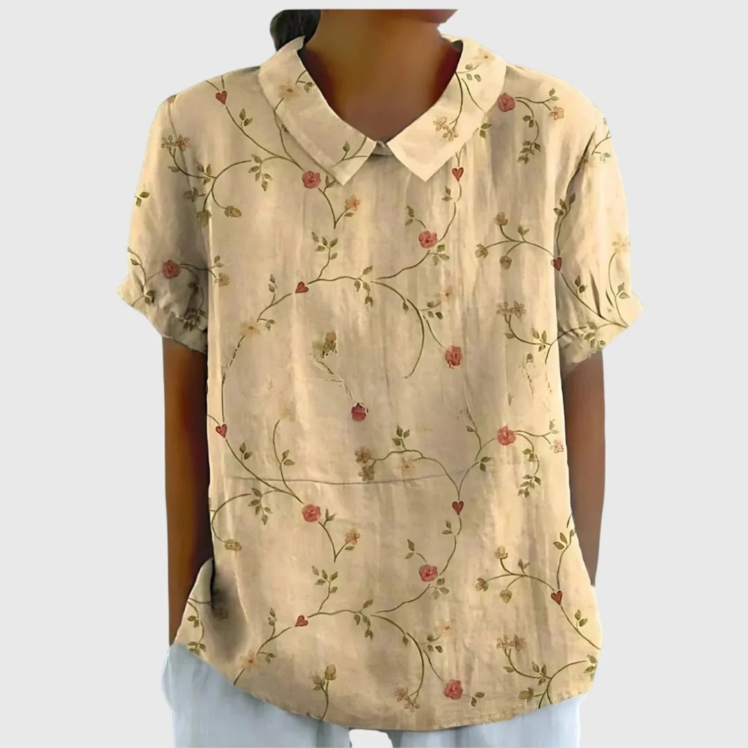 Side pocket detail on women's linen floral blouse with relaxed silhouette
