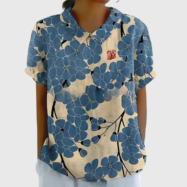 Women's linen floral blouse collection showing multiple colourways with botanical print