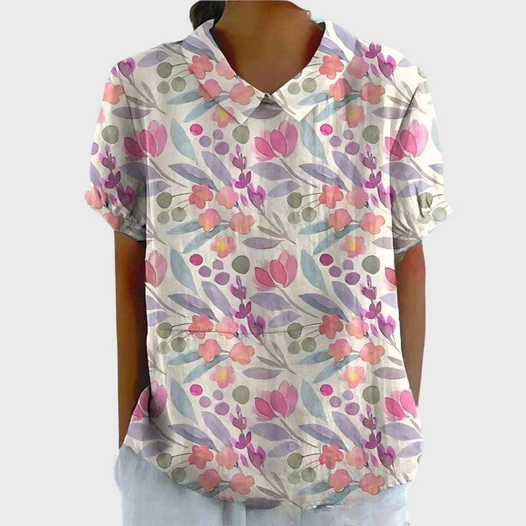 Women's linen floral blouse styled for casual wear with relaxed fit and side pockets