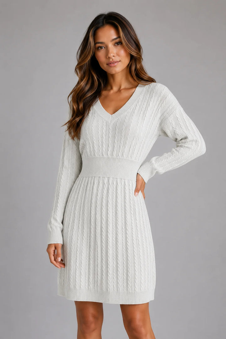 Women's cable knit dress styled with natural drape and structured silhouette
