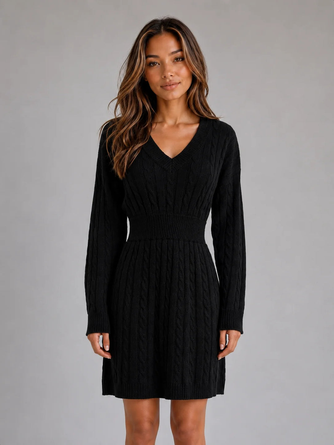 Detail shot of shirred waist and cable knit pattern on midi dress