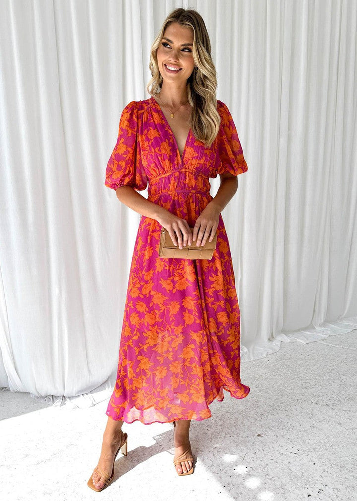 Floral maxi dress with V-neckline and gathered waist detail shown from the front