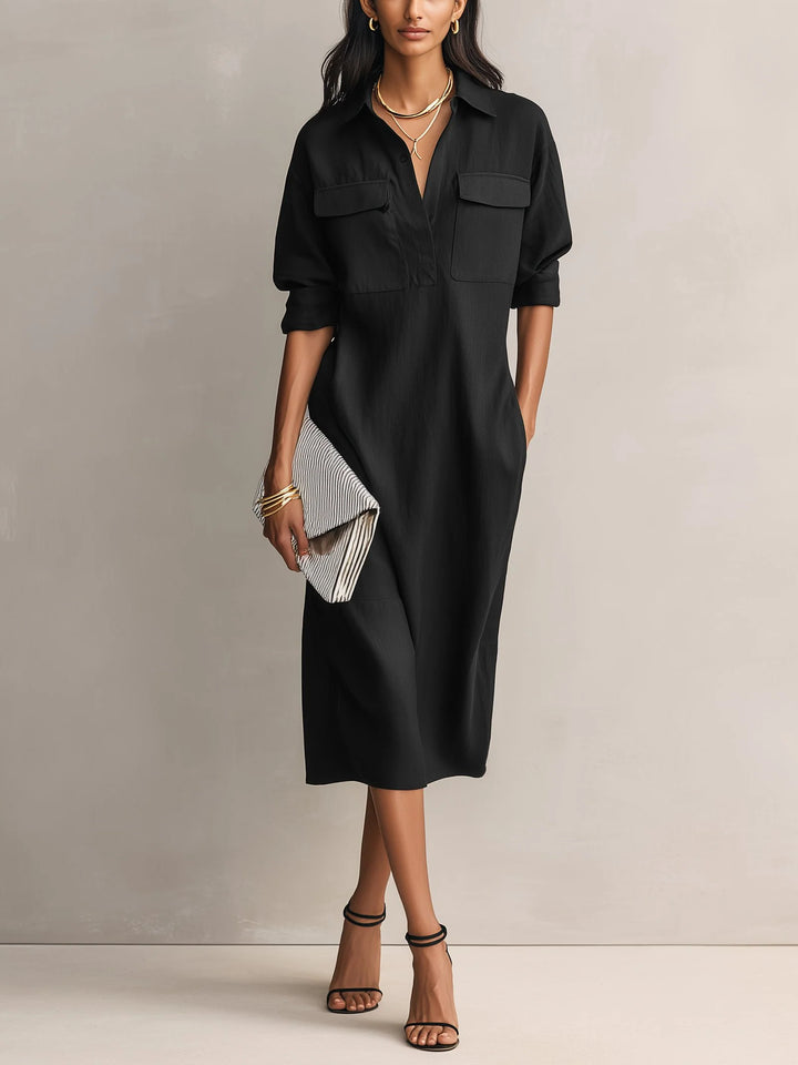 Women's midi shirt dress in black with collared V-neckline and dual chest pockets