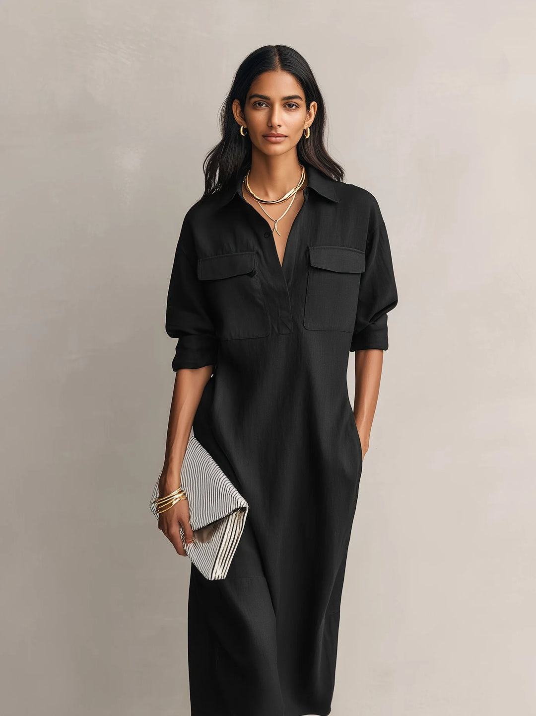 Close-up view of women's midi shirt dress showing structured chest pockets and elbow sleeves