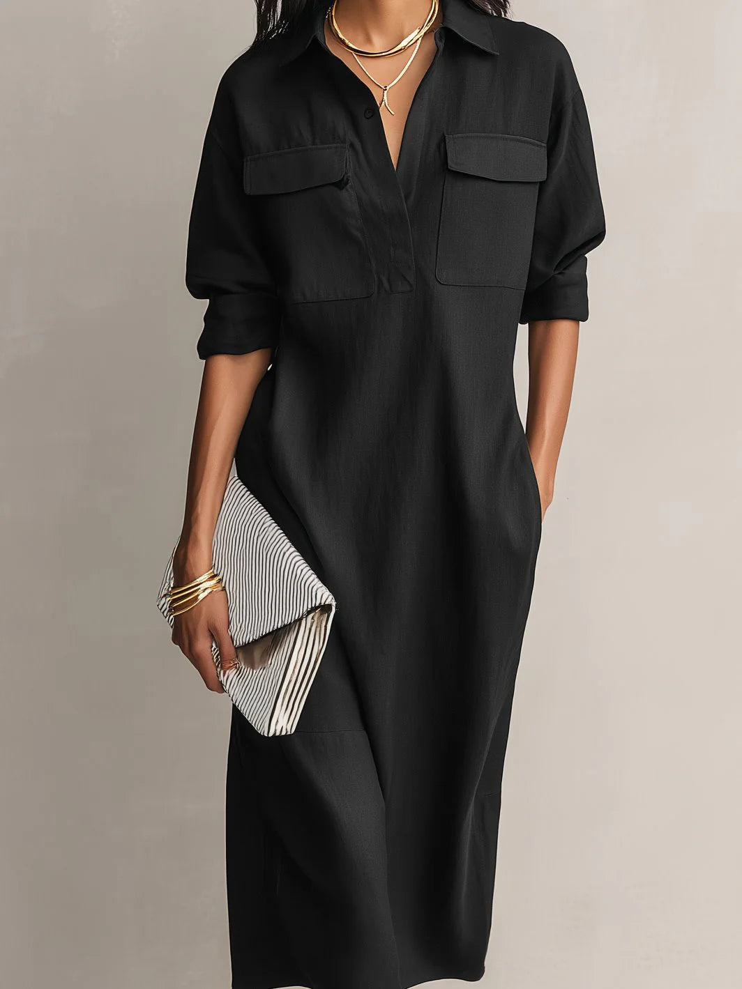 Full-length view of women's midi shirt dress styled with heeled sandals and clutch