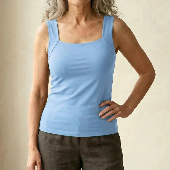 Woman wearing versatile square neck tank top as layering piece for casual wear