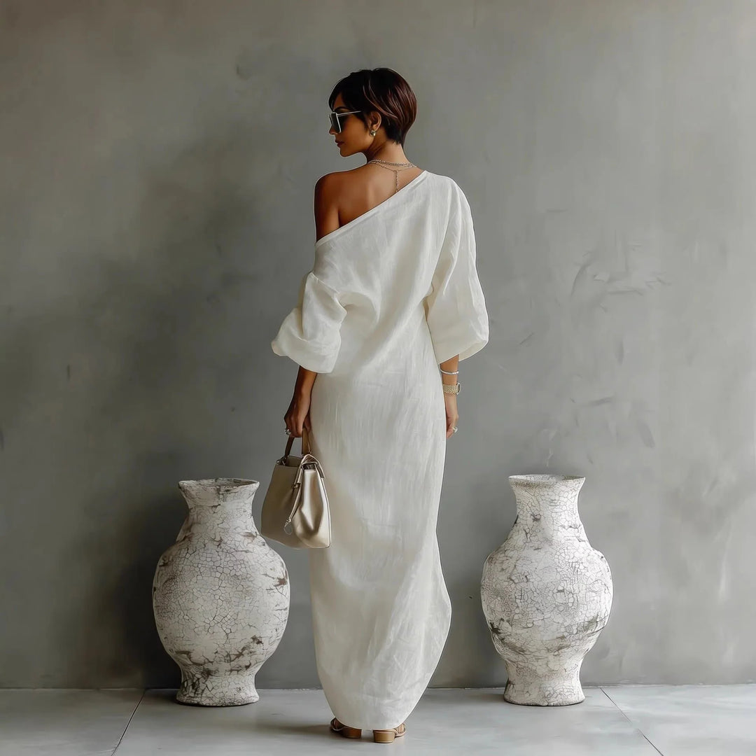 Back view of one-shoulder maxi dress with dropped shoulder and textured finish