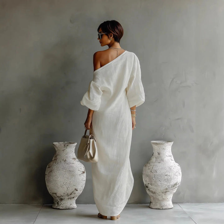 Back view of one-shoulder maxi dress with dropped shoulder and textured finish