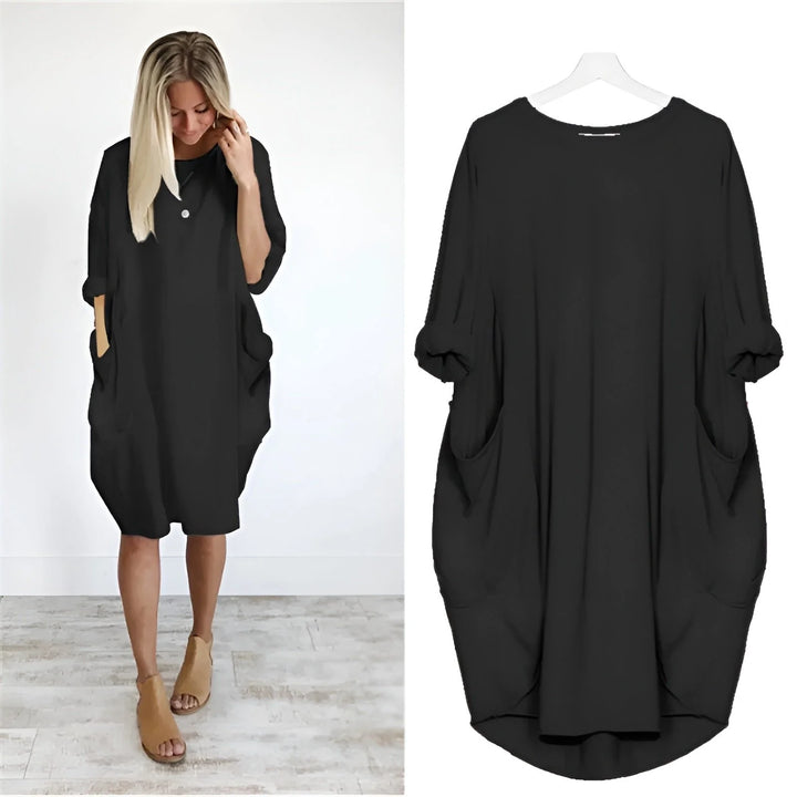 Oversized midi dress with batwing sleeves and side pockets in relaxed fit silhouette