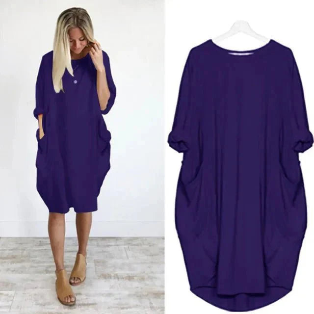 Oversized midi dress styled for casual daywear with relaxed fit and practical pockets