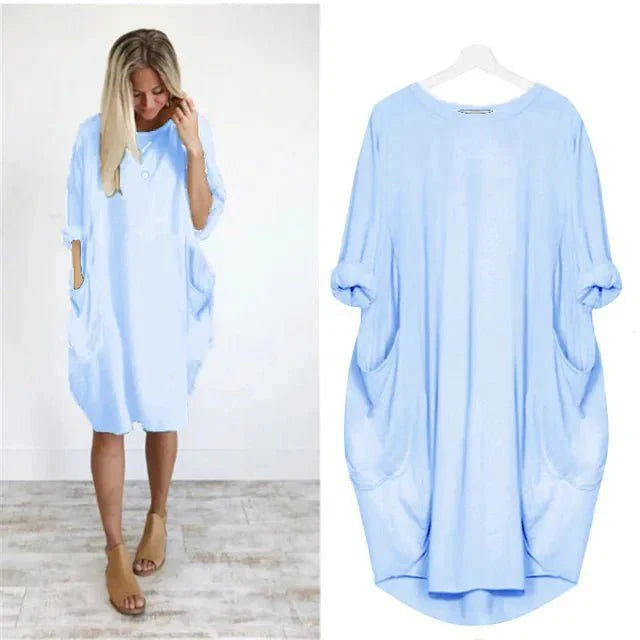 Detail view of oversized midi dress batwing sleeve and relaxed fit silhouette