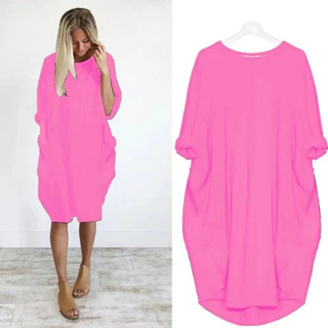 Oversized midi dress in knee-length cut with practical side pockets and flowing drape