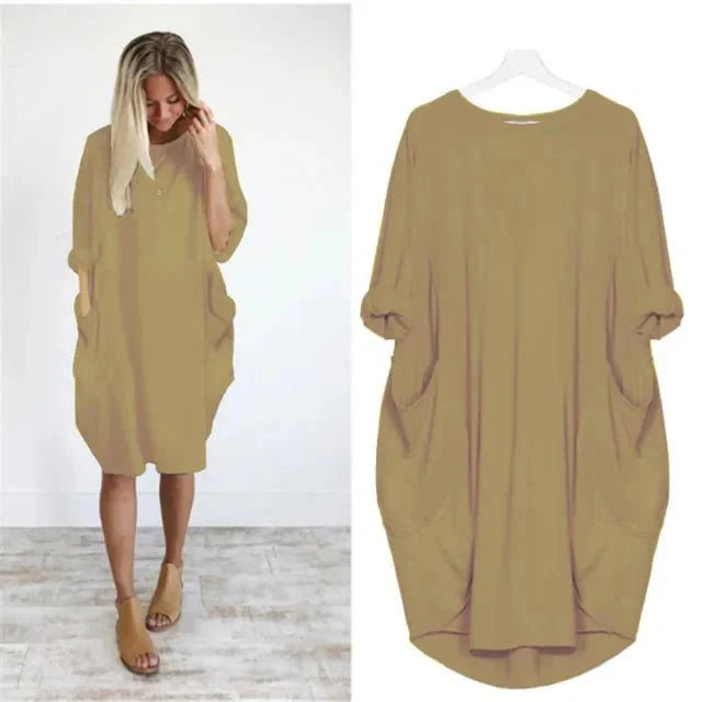Full view of oversized midi dress showing relaxed silhouette and batwing sleeve design