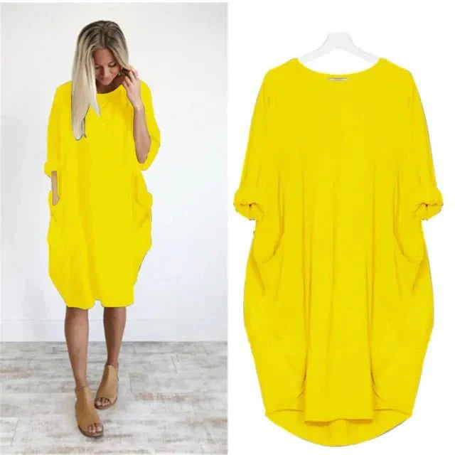 Side view of oversized midi dress showing flowing drape and midi length cut