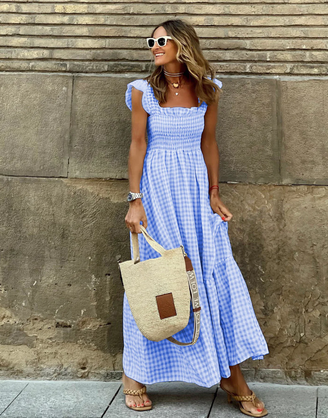 Detail of elasticated smocking on bodice of gingham summer maxi dress with square neckline