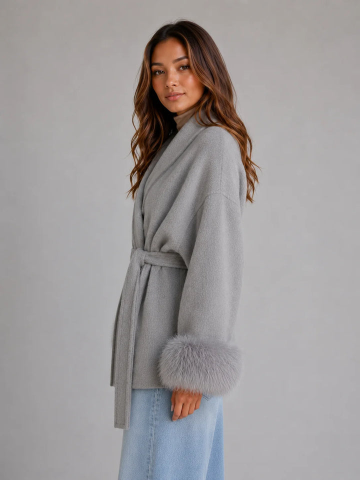 Grey wool blend coat featuring detachable faux fur trim cuffs and shawl collar detail
