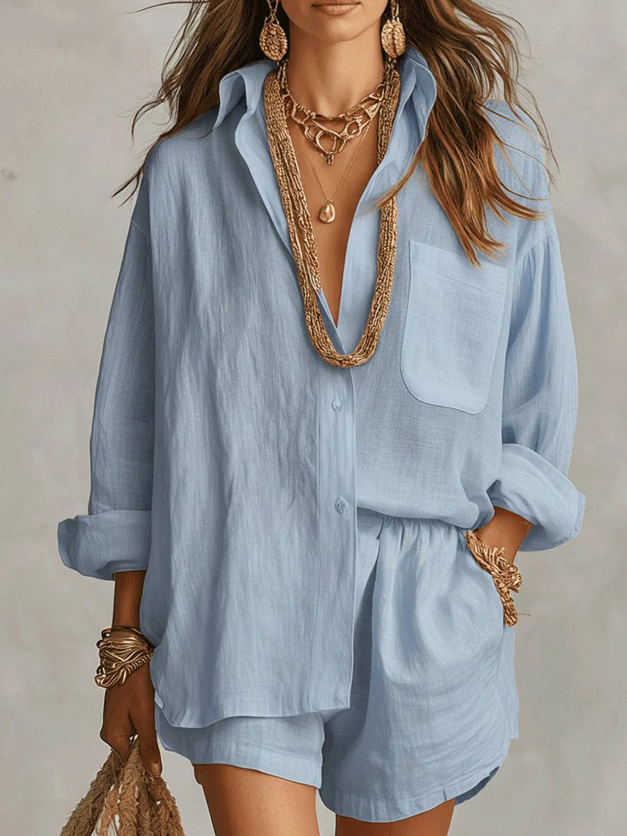 Close-up view of oversized linen shirt showing collar detail, chest pocket, and natural fabric texture