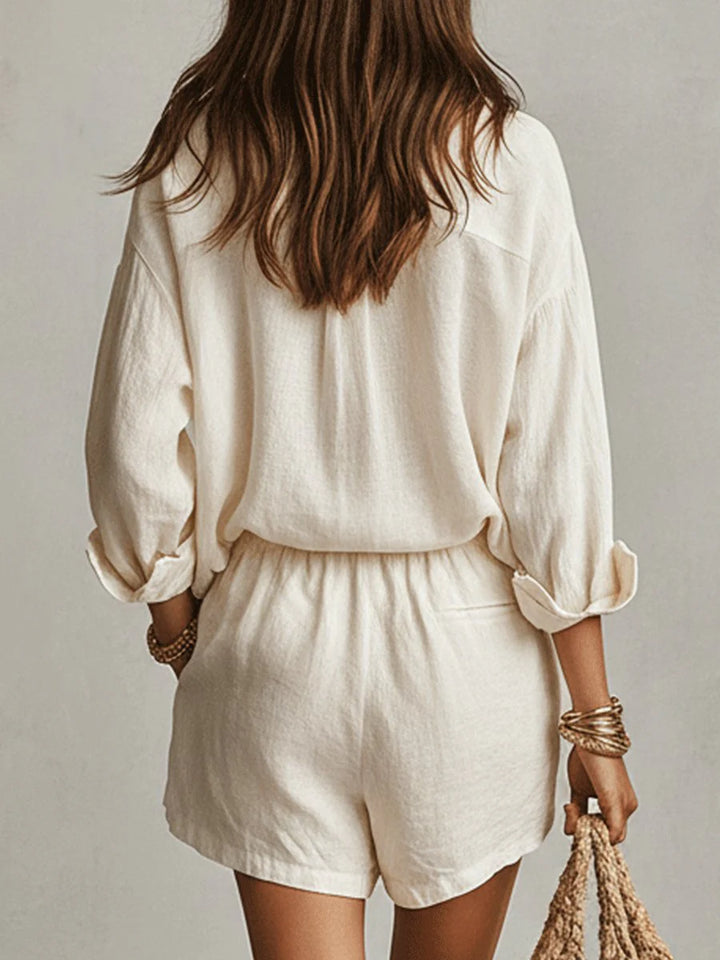 Lifestyle shot of linen shirt and shorts set worn casually with layered jewellery